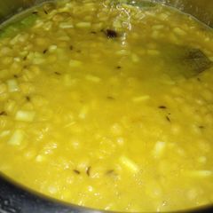 A picture of Chana dal with coconut (narkol diye cholar dal).