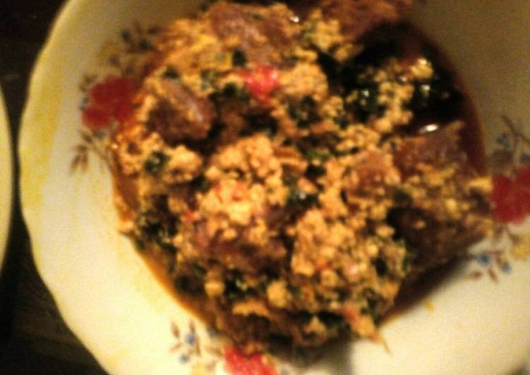 How to Winter Yummy Egwusi soup garnished with ugu leaves