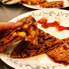 A picture of Calzone Pizza Parantha.