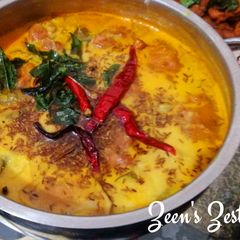 A picture of Kadhi Pakoras with Finger Chillies.