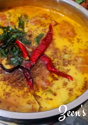 A picture of Kadhi Pakoras with Finger Chillies.
