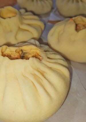 Una foto de Pan al vapor relleno de pollo a la italiana