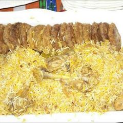 A picture of Chicken biryni with kabab.
