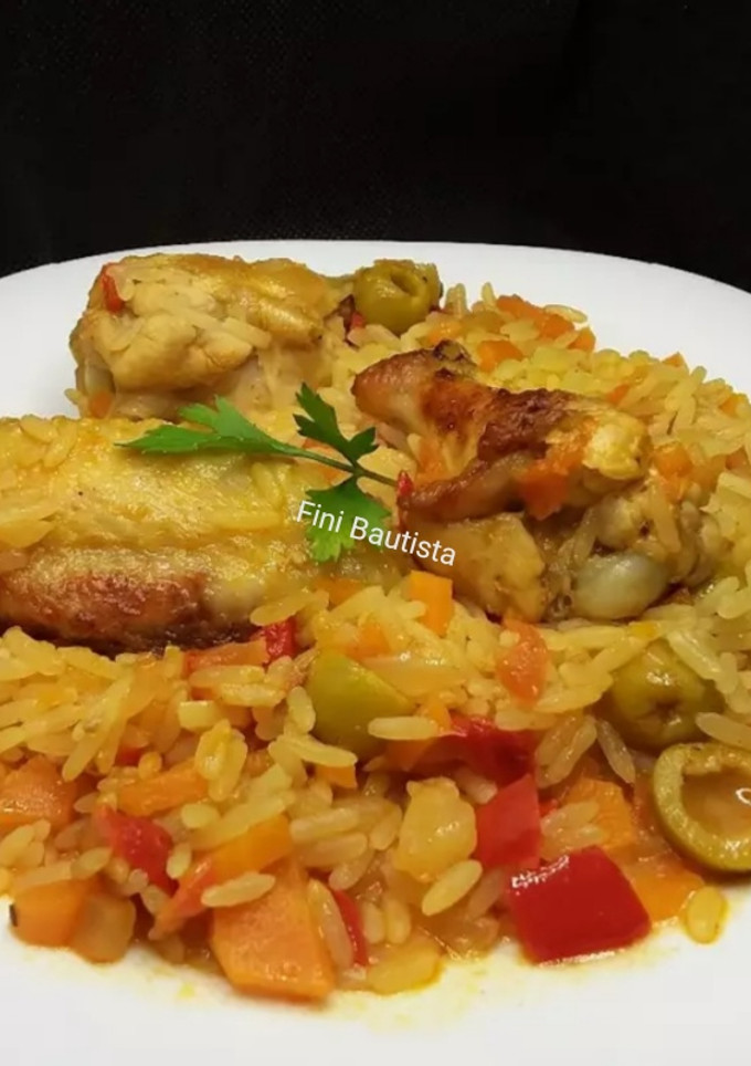Una foto de Arroz con alitas de pollo