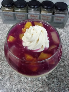 A picture of Mango mousse and Raspberry jelly dessert.