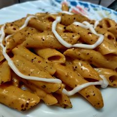 A picture of Orange pasta.