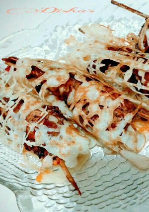A picture of Teriyaki prawns with net crepes.