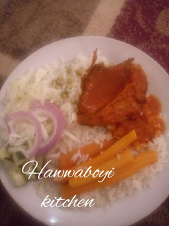 A picture of Peas Rice with chicken stew.