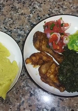 A picture of Grilled Chicken with Veggies and Ugali.