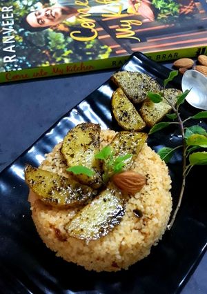 A picture of Daliya couscous with curry leaf pesto crusted potatoes.