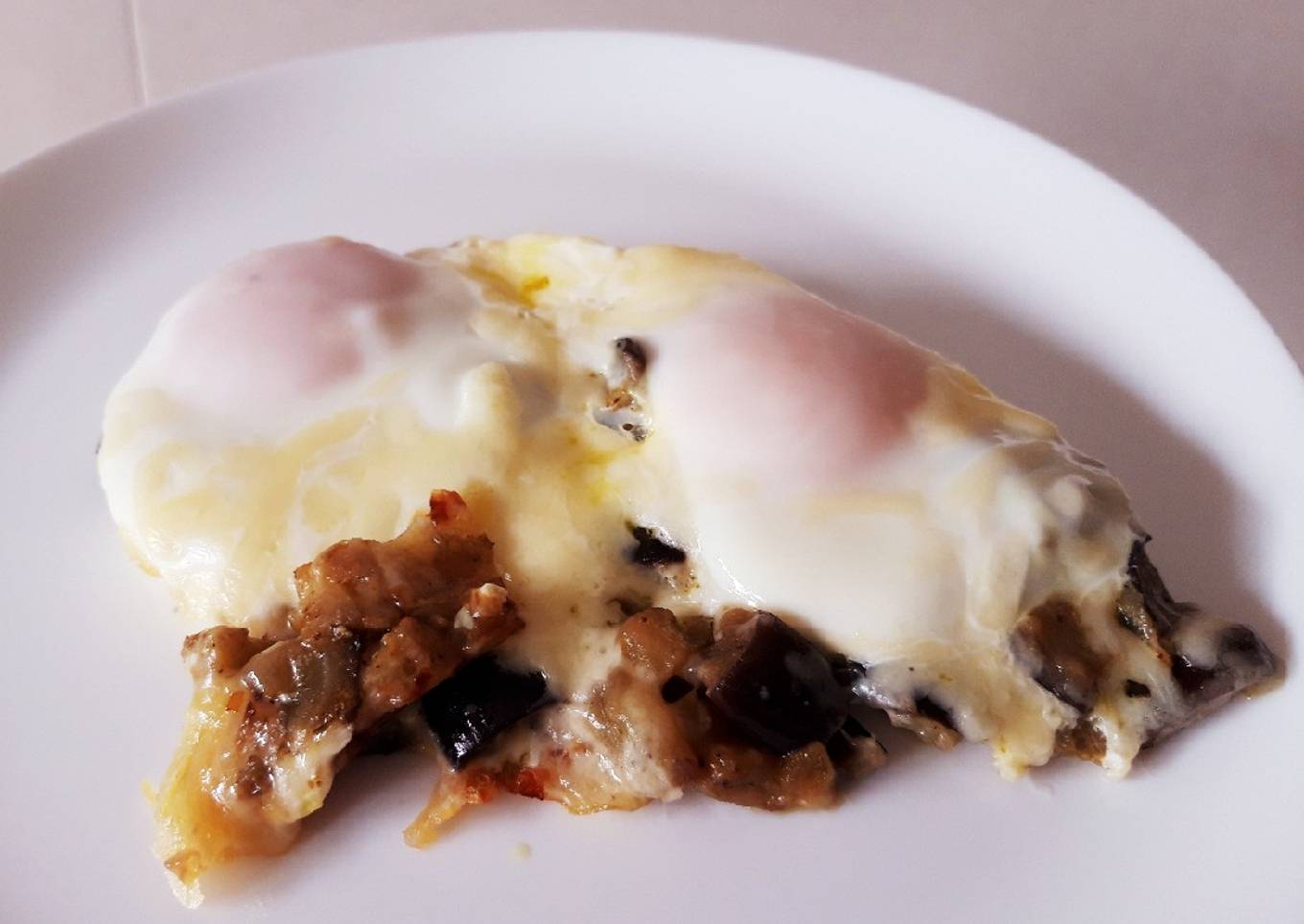 Berenjena al ras el hanout con huevos