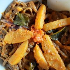 Peels of raw banana with potato curry A picture of Peels of raw banana with potato curry.