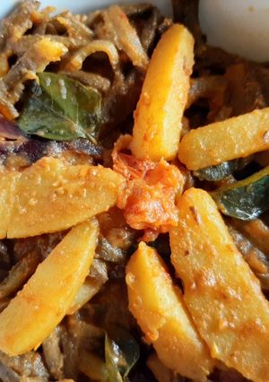 A picture of Peels of raw banana with potato curry.