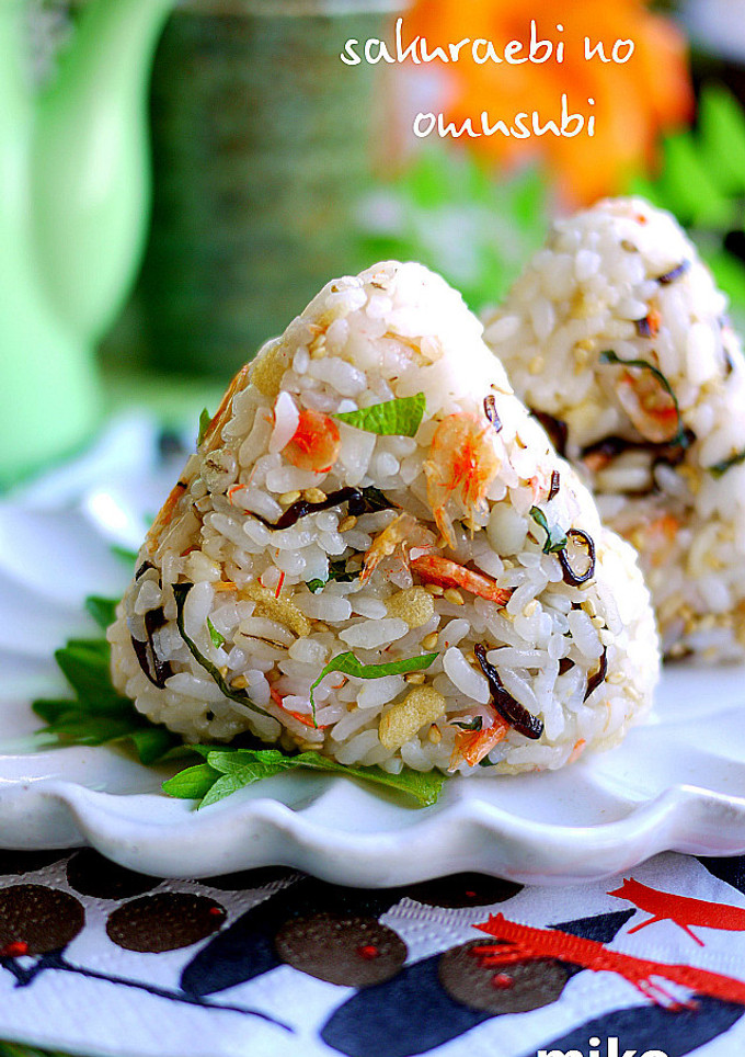 A picture of Rice Balls with Tempura Bits and Sakura Shrimp.