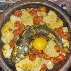 A picture of Moroccan Baked Fish Tagine with Potatoes & Cherry Tomatoes.