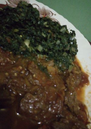 A picture of Beef stew with sukuma wiki.