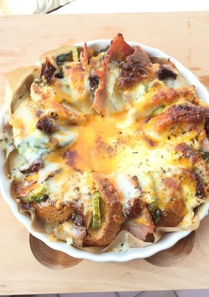 A picture of Ham And Sun Dried Tomato With Basil Bread Pizza Top Spicy Brown Butter.