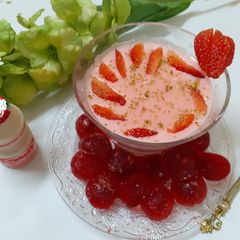 A picture of Strawberry Phirni with Yakult.