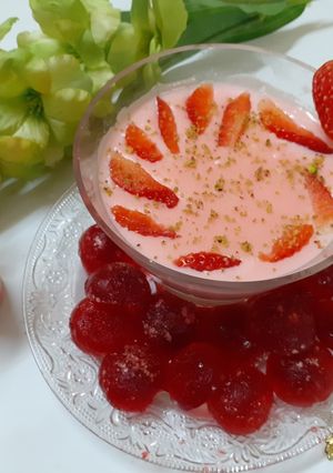 A picture of Strawberry Phirni with Yakult.
