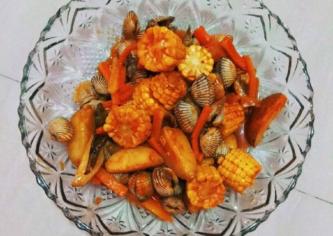 Wajib coba! Bagaimana cara buat Kerang Dara Saus Padang  enak