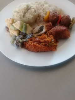 A picture of Chicken fillet with salads and meat balls.