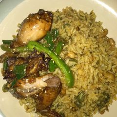 A picture of Jollof rice with grill chicken.