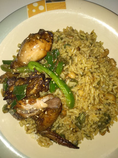 A picture of Jollof rice with grill chicken.