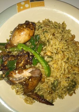 A picture of Jollof rice with grill chicken.