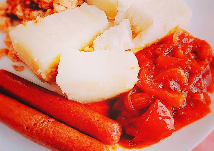 Boiled yam,pepper sauce and sausages