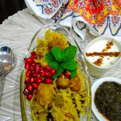 A picture of Mushrooms and Soya Biryani with veggies.