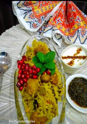 A picture of Mushrooms and Soya Biryani with veggies.