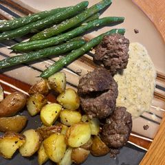 A picture of Meatloaf balls with creamy thyme sauce.