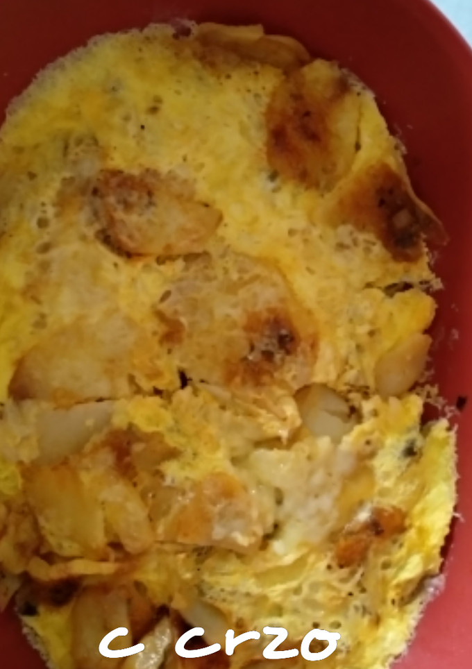 Una foto de Patatas con queso y huevos