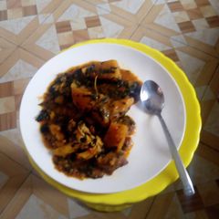 A picture of Yam porridge with vegetable.