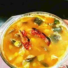 A picture of South Indian Recipe Brinjal Rasam In Pressure Cooker.