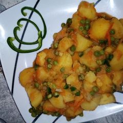 A picture of Irish potatoes with peas.