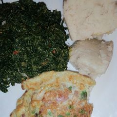 Ugali, kunde cooked in cream with scrambled vegetable eggs A picture of Ugali, kunde cooked in cream with scrambled vegetable eggs.