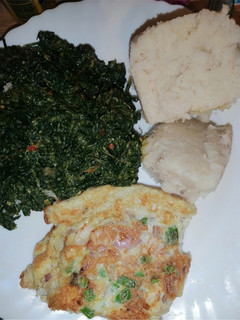 A picture of Ugali, kunde cooked in cream with scrambled vegetable eggs.