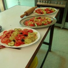 A picture of Cucumber and tomato salad with crushed peanuts.