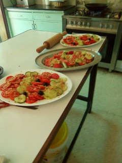A picture of Cucumber and tomato salad with crushed peanuts.
