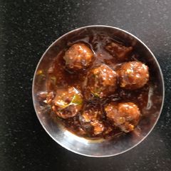 A picture of Veg manchurian with gravy.