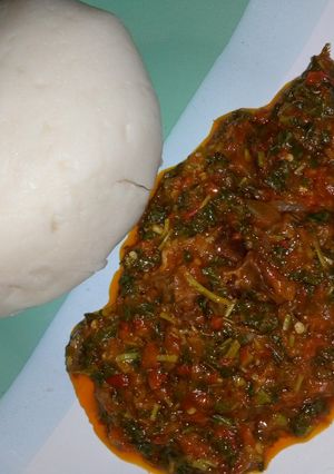 A picture of Pounded yam and vegetable soup.