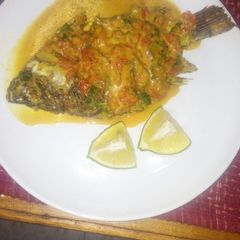 A picture of Tilapia in coconut sauce.