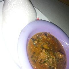A picture of Tuwon shinkafa with okro soup.