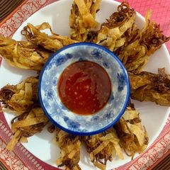 A picture of Left over chowmien wrapped with torn Manda patti strips.