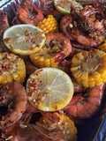 Spicy lemon butter garlic shrimp with corn