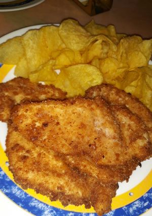 Una foto de Pollo rebozado con galletas y coco