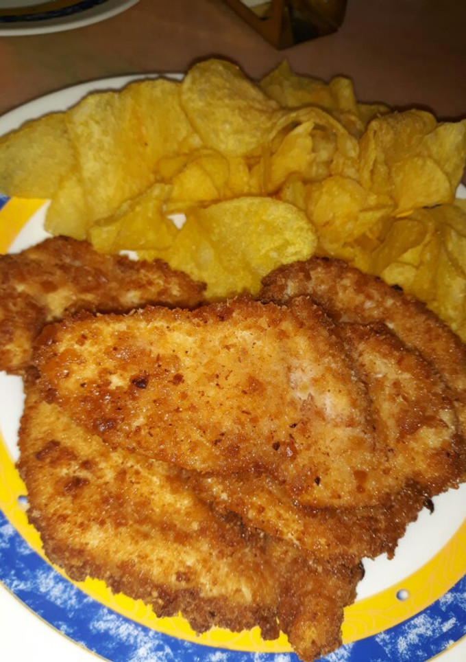 Una foto de Pollo rebozado con galletas y coco