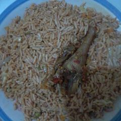 A picture of Fried rice and chicken.