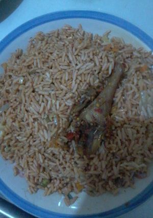 A picture of Fried rice and chicken.
